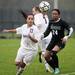 Huron sophomore Dionne Bailey and Dexter junior Bethany Shiguango eyes down a loose ball on Tuesday, April 23. Daniel Brenner I AnnArbor.com